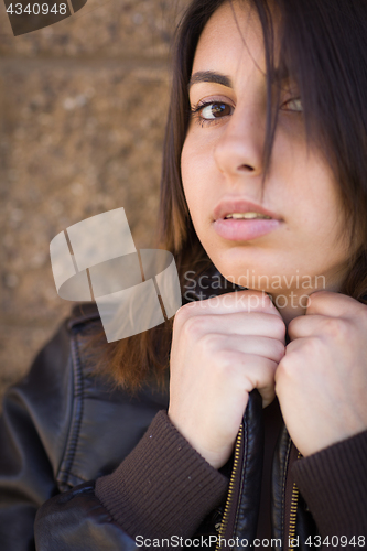 Image of Beautiful Meloncholy Mixed Race Young Woman Portrait Outside.