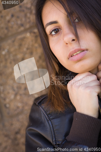 Image of Beautiful Meloncholy Mixed Race Young Woman Portrait Outside.