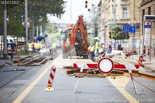 Image of Workers repair the tram line in the city