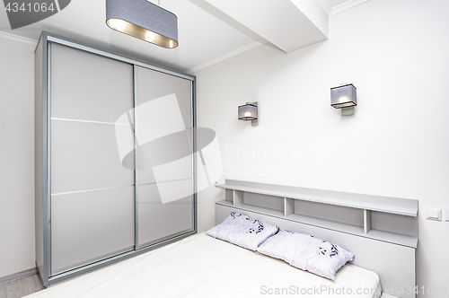 Image of Simple white empty bedroom interior