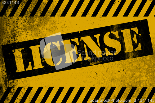 Image of License sign yellow with stripes