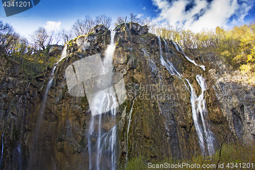 Image of Plitvice Lakes with a big waterfall under the blue sky National 