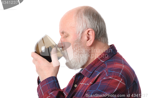 Image of senior man drinking from cup, isolated on white