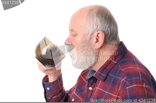 Image of senior man drinking from cup, isolated on white