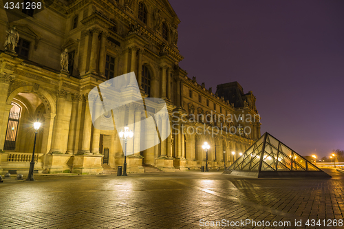 Image of View of famous Louvre Museum with Louvre Pyramid