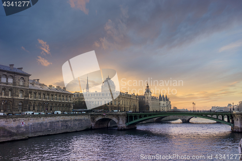 Image of Bridge by the Seine river in Paris at night