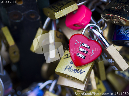 Image of Love locks in Paris bridge symbol of friendship and romance