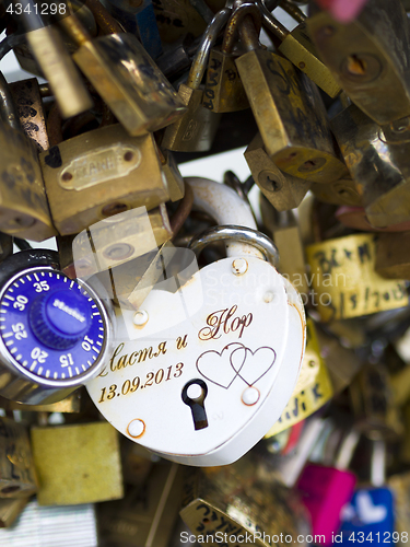 Image of Love locks in Paris bridge symbol of friendship and romance