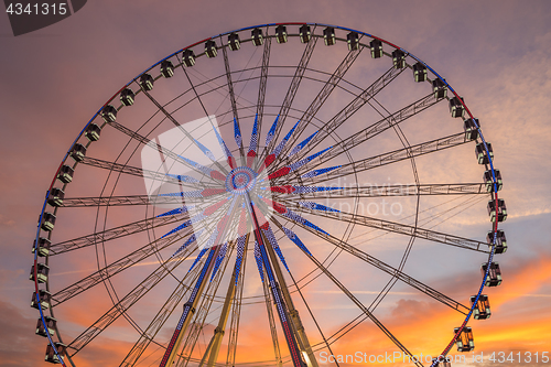 Image of Place de la Concorde at sunset. Ferris wheel and Egyptian obelis