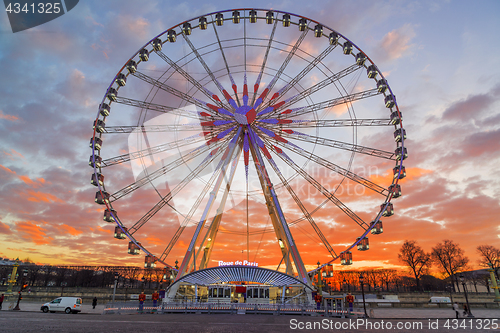 Image of Place de la Concorde at sunset. Ferris wheel and Egyptian obelis