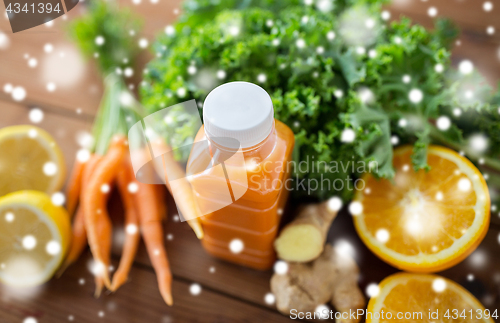 Image of bottle with carrot juice, fruits and vegetables