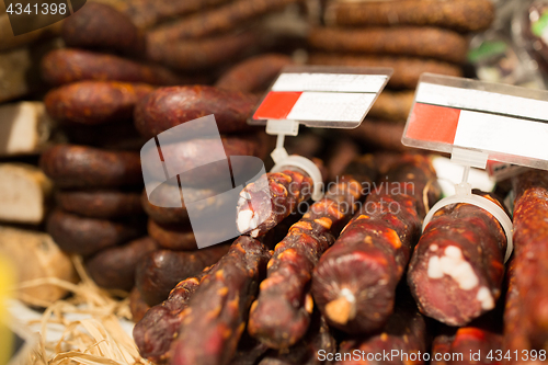 Image of smoked meat products at market or butcher shop