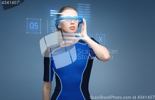 Image of woman in virtual reality 3d glasses with charts