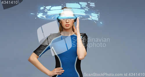 Image of woman in virtual reality 3d glasses with screens