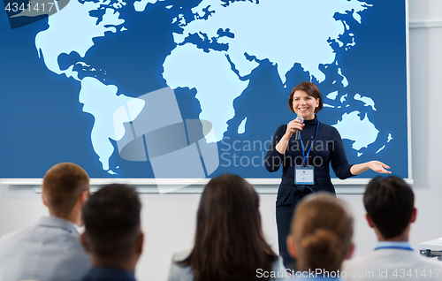 Image of group of people at business conference or lecture