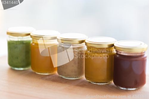 Image of vegetable or fruit puree or baby food in jars