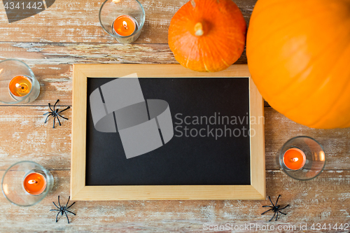Image of blank chalkboard and halloween decorations