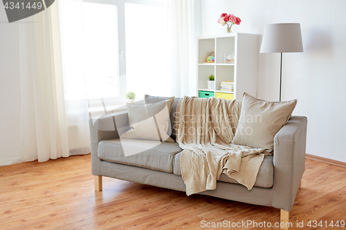 Image of sofa with cushions at cozy home living room