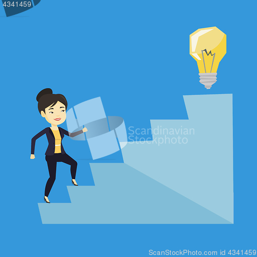 Image of Business woman walking upstairs to the idea bulb.