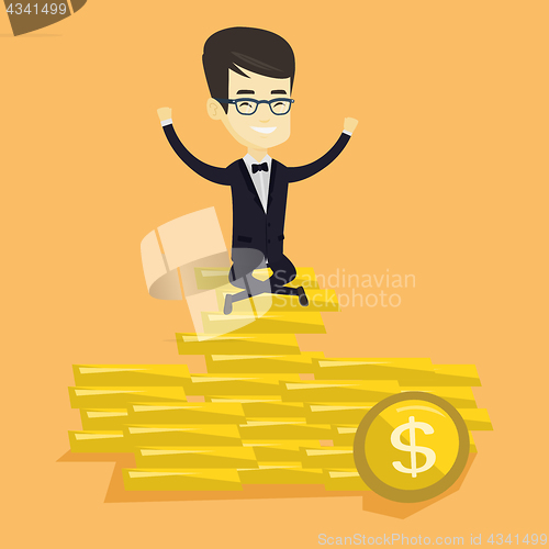 Image of Happy business man sitting on golden coins.