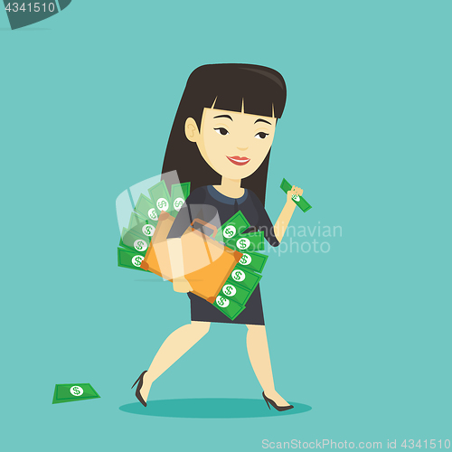 Image of Business woman with briefcase full of money.