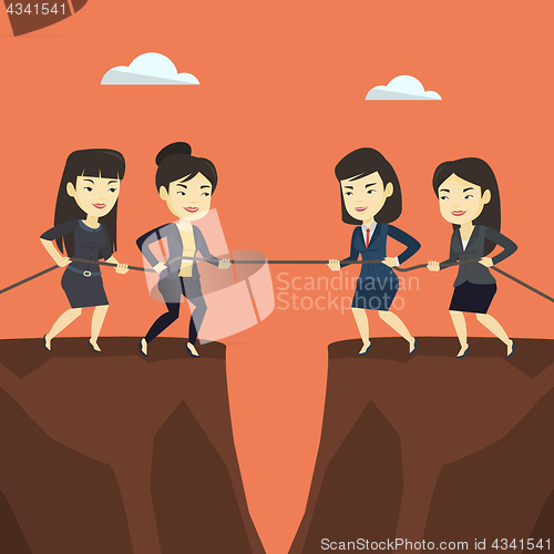 Image of Two groups of business people pulling rope.