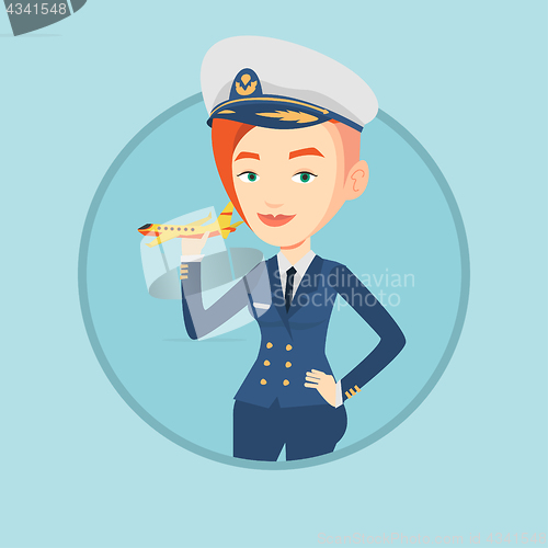 Image of Cheerful airline pilot with model airplane.