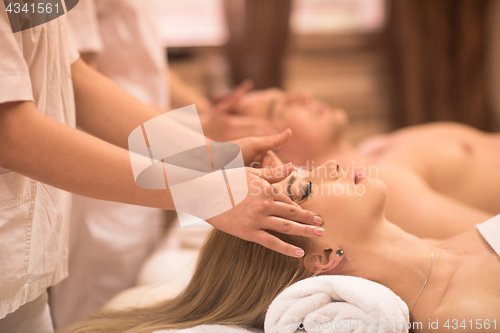 Image of couple enjoying head massage at the spa