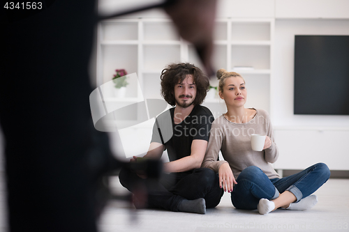 Image of young couple in their new home