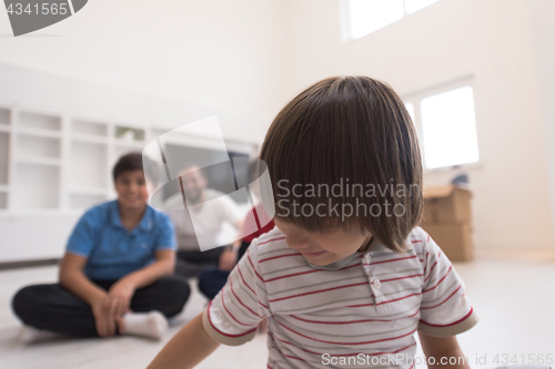 Image of portrait of happy young boys with their dad