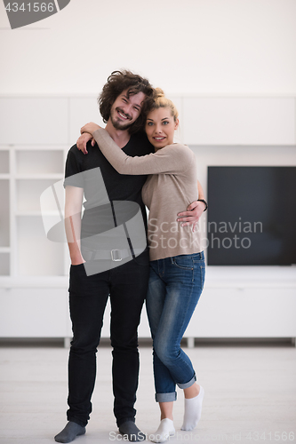 Image of couple hugging in their new home