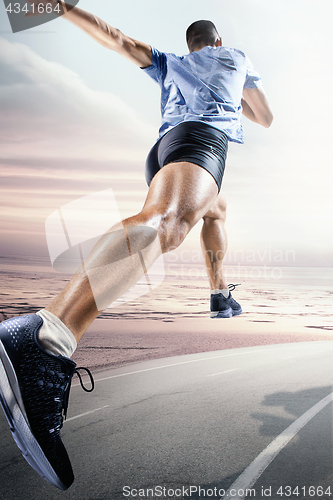 Image of Sport backgrounds. Sprinter starting on the running track.