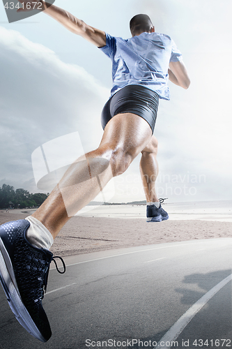 Image of Sport backgrounds. Sprinter starting on the running track.