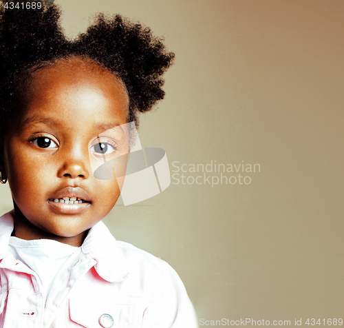 Image of little cute sweet african-american girl playing happy with toys 