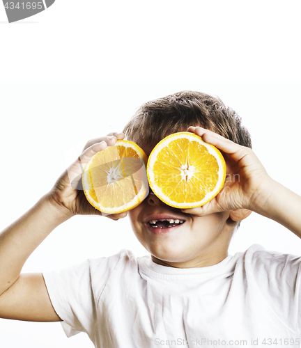 Image of little cute boy with orange fruit double isolated on white smili