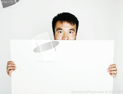 Image of pretty cool asian man holding empty white plate smiling