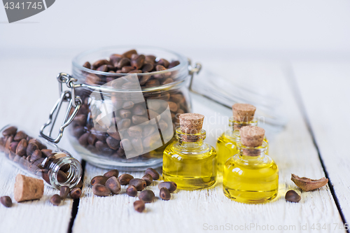 Image of The cedar oil in a glass bottle