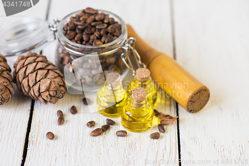 Image of The cedar oil in a glass bottle