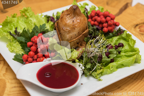 Image of quail roasted with sweet and sour cranberry sauce