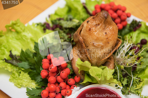 Image of quail roasted with sweet and sour cranberry sauce