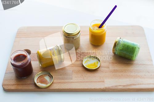 Image of vegetable or fruit puree or baby food in jars