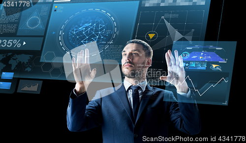 Image of businessman with virtual projection over black