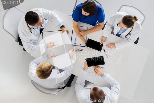 Image of doctors with cardiograms and tablet pc at hospital