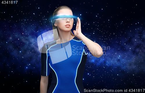 Image of woman in virtual reality 3d glasses over black