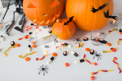 Image of carved halloween pumpkins and candies