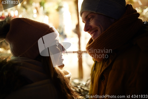 Image of close up of happy couple in winter closes