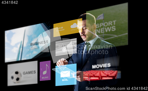 Image of businessman with tablet pc and multimedia