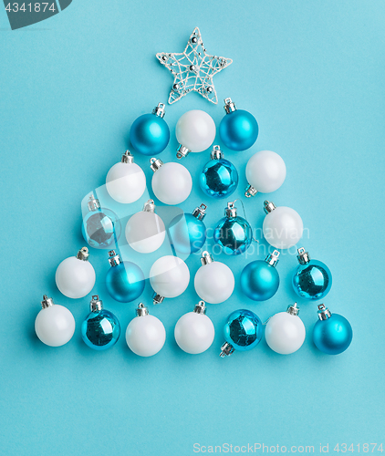 Image of Christmas tree made of white and blue baubles