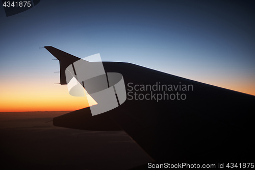 Image of Seeing the sunset on flight