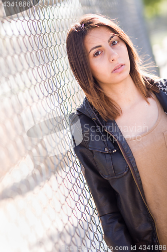 Image of Beautiful Meloncholy Mixed Race Young Woman Portrait Outside.